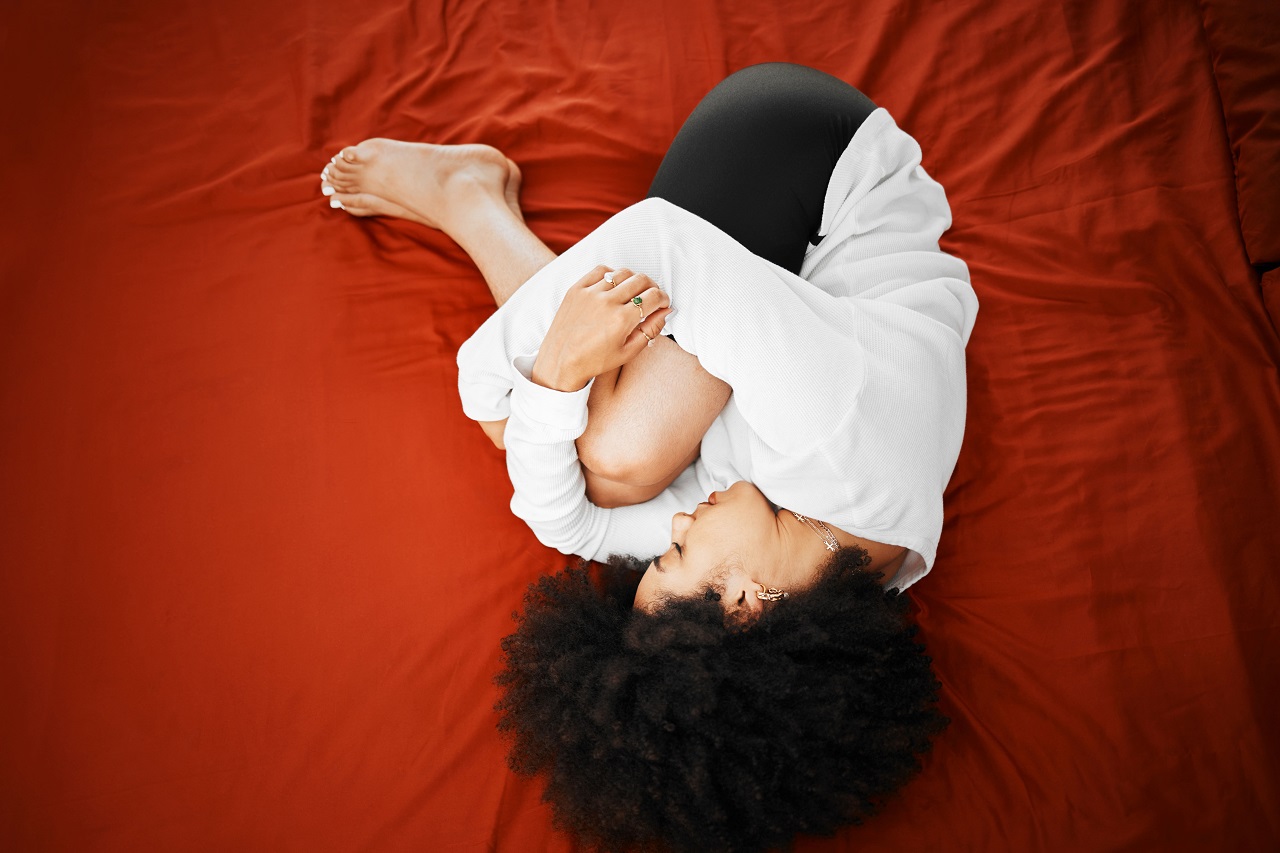 Why do we assume the foetal position when crying?